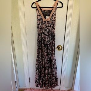 Brand new dress, never worn. Beautiful pink and black XS.